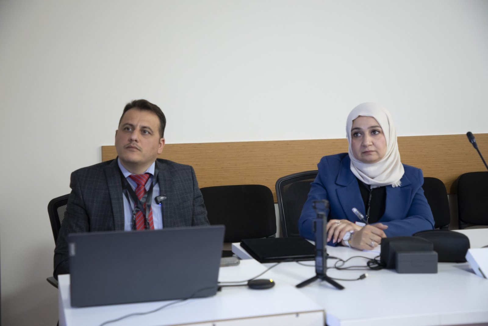 Session moderators at the table during a paper session